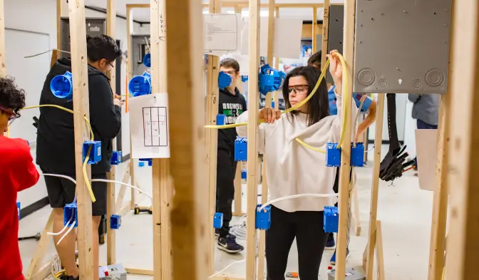 technical training classroom of students learning to run electrical wiring